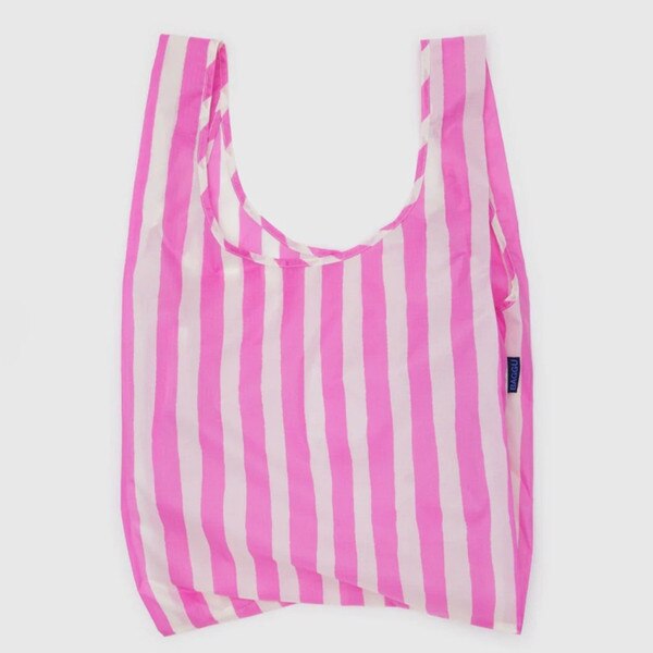 Pink and white vertically striped reusable BAGGU bag with blue logo tag